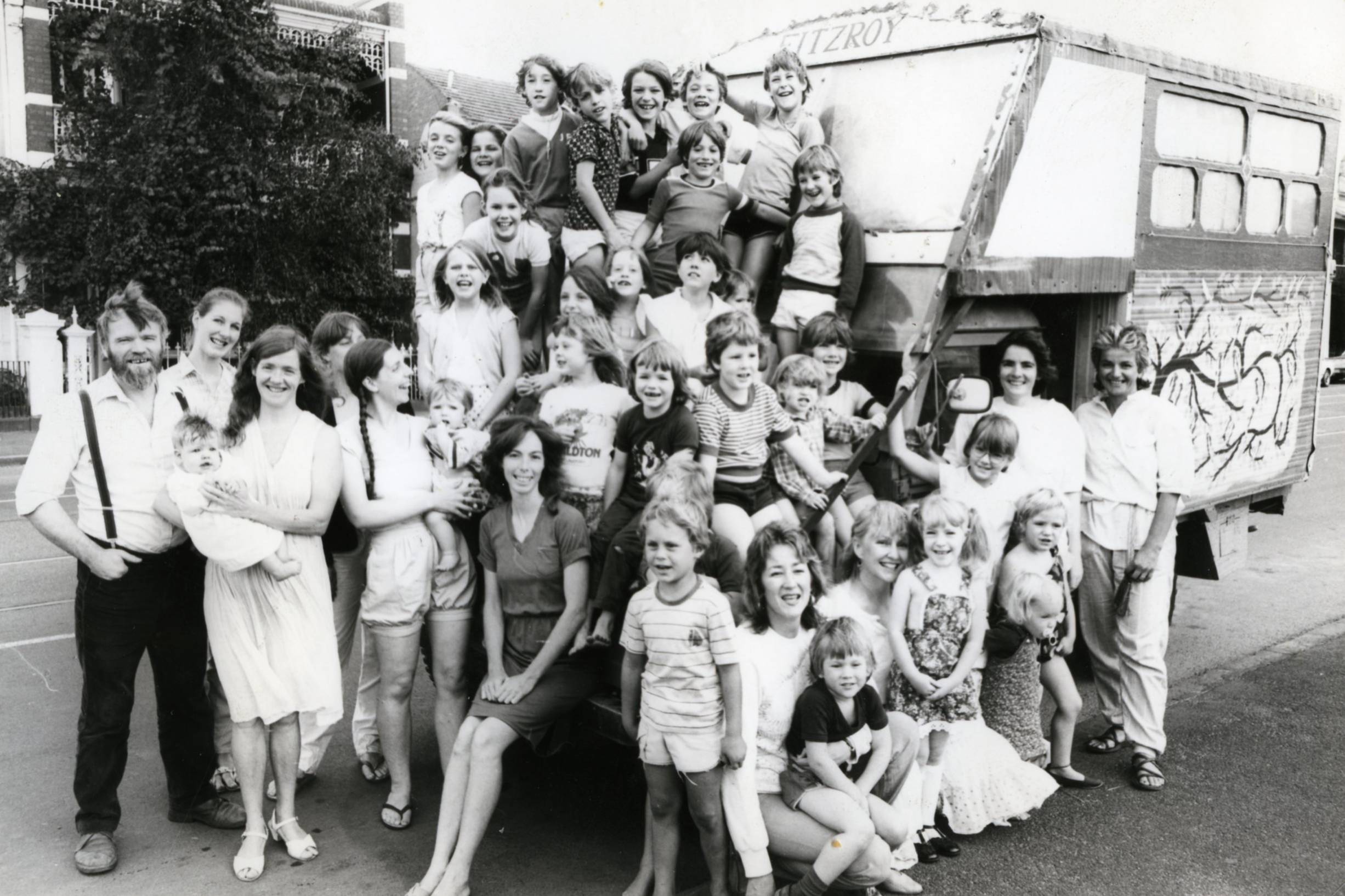 Kids in front of the bumpy bus