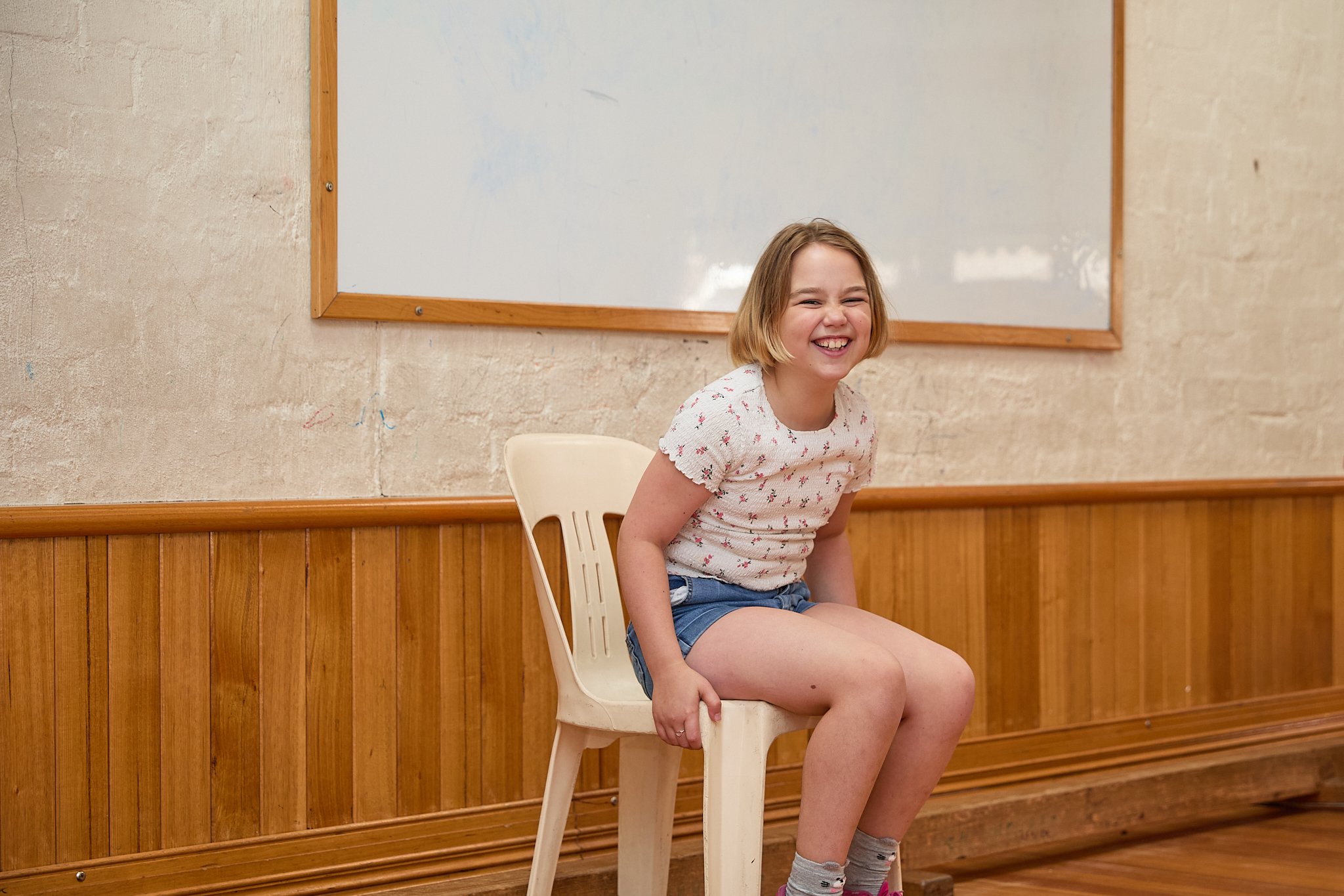Girl sitting and smiling